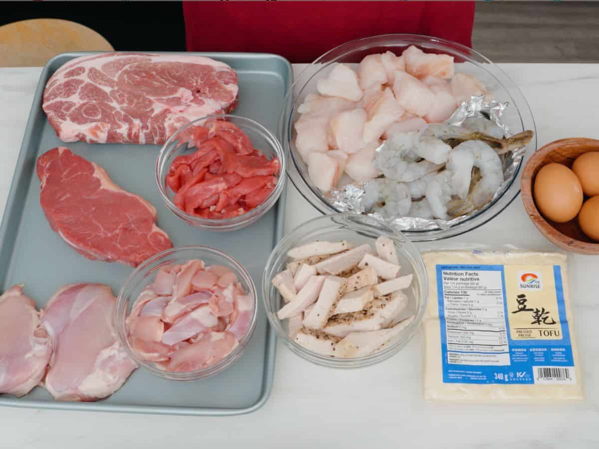 a variety of meats and seafood, tofu and eggs.