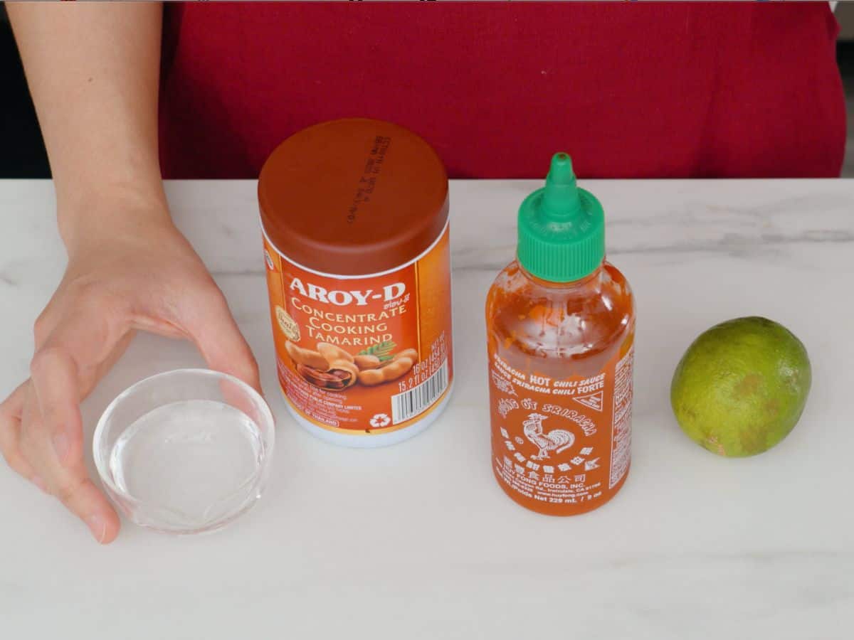 vinegar, tamarind paste, sriracha and a lime