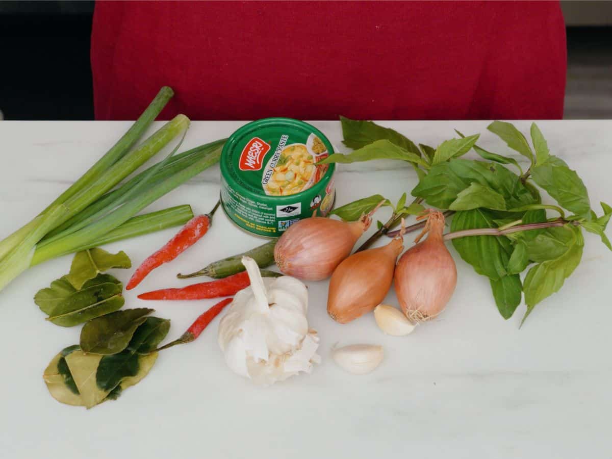 garlic, shallots, chilies, thai basil, makrut lime leaves, green onion, curry paste.