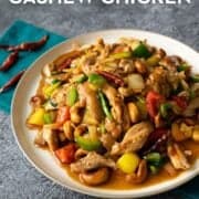a plate of cashew chicken with text overlay "ultimate thai cashew chicken hotthaikitchen.com"