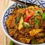 A bowl of Thai glass noodle stir-fry with baby corn and Thai eggplant