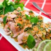 a plate of moo manao on red napkin