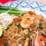 A pinterest image of pad thai shrimp with text that says "authentic pad thai"