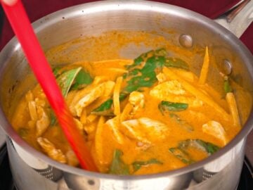 a pot of red curry chicken with bamboo shoots