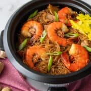 Noodles and shrimp in a rice cooker with text "How to Cook Noodles in a Rice Cooker"