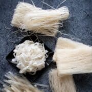 5 types of rice noodles on dark background with text "ultimate guide to perfect rice noodles"