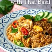 A plate of fried rice with cucumber slices with text overlay "3-chili fried rice with Thai basil"