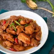A plate of caremel chicken with text "vietnamese caramel chicken"