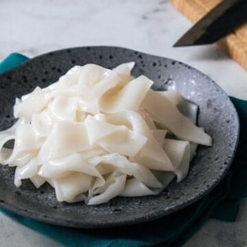 a plate of fresh rice noodles